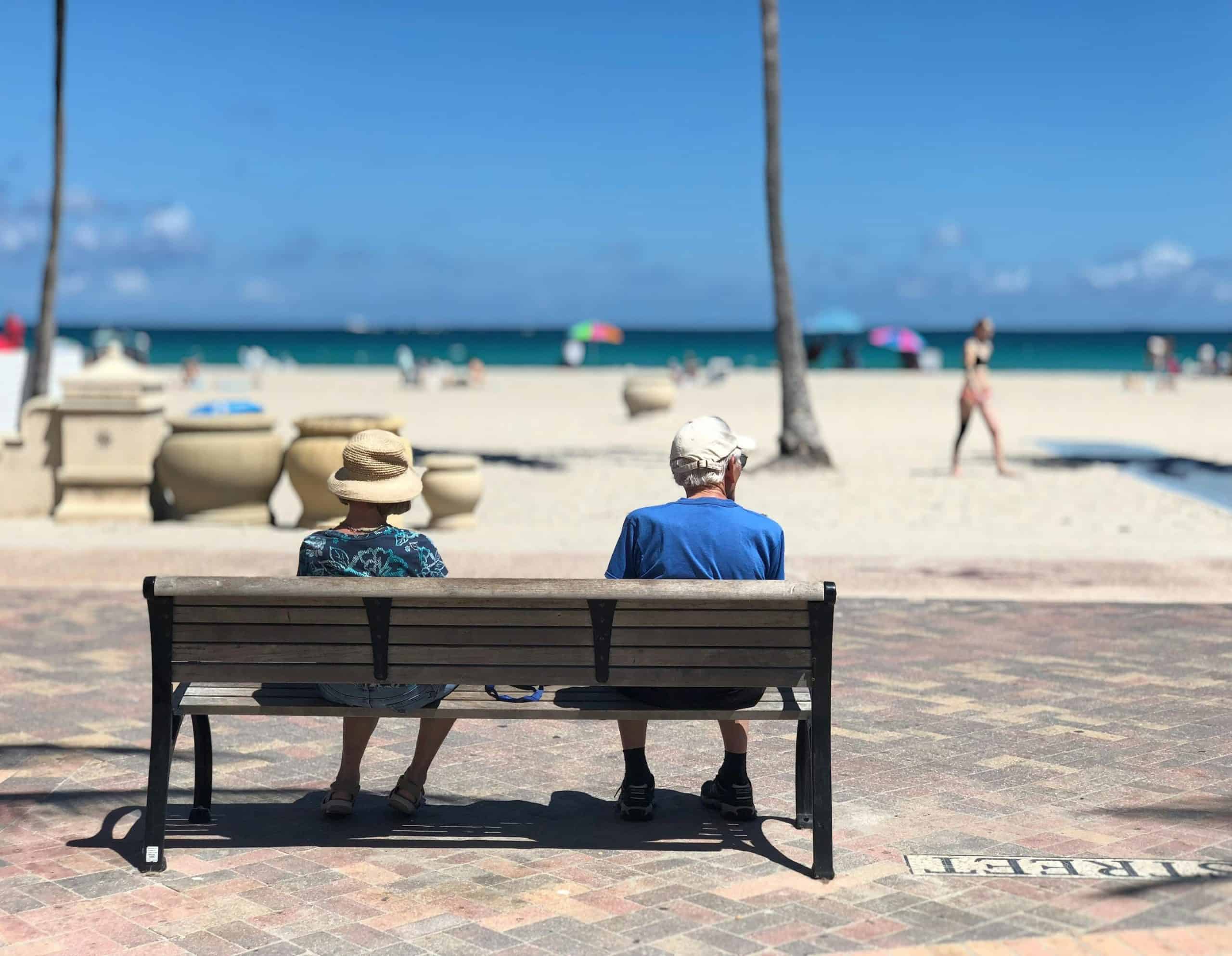 Old couple ona bench by the sea
